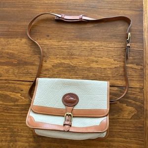 Vintage Dooney and Bourke all weather leather. Some minor stains on the back.